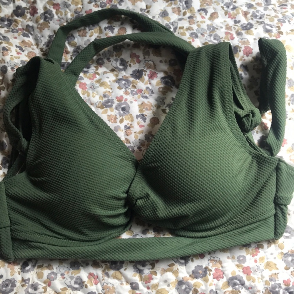 I’m selling a olive green swim top worn once .